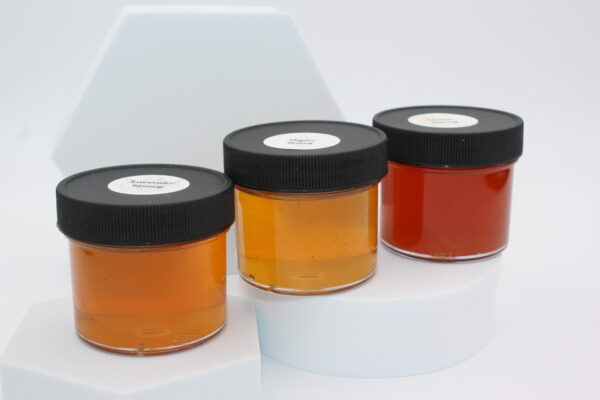 Closeup of the infused honeys used in the honey trio