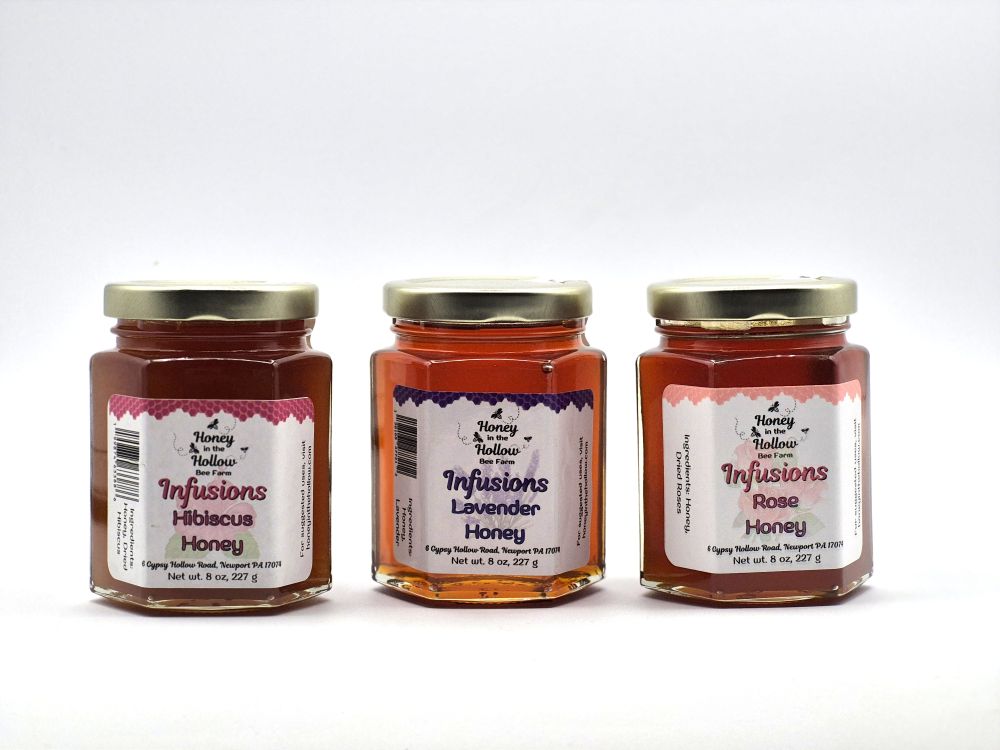lavender, hibiscus and rose infused honeys in 8 oz hex glass jars