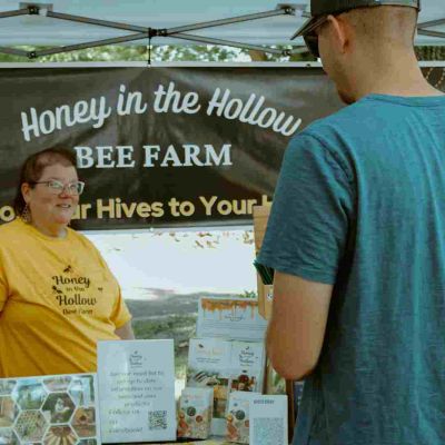 sue helping customer decide on the right honey