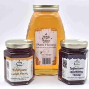 wellness bundle-lemon and elderberry infused honey and raw honey glass